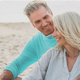 Smiling older couple enjoying time together on the beach