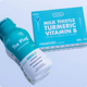 The Plug liver support drink bottle next to its Milk Thistle Turmeric Vitamin B supplement box