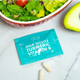 The Plug Milk Thistle Turmeric Vitamin B liver support packet and capsules next to a salad and avocado