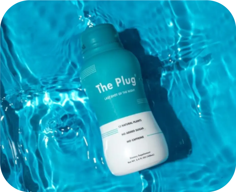 The Plug liver supplement drink, Last Shot of the Night, floating in blue pool water