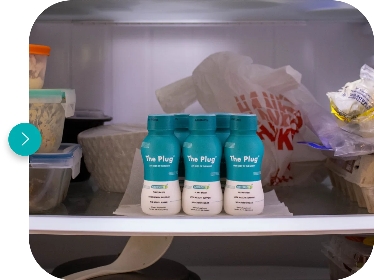 Three bottles of The Plug liver health drink stored in a refrigerator