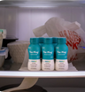Three bottles of The Plug liver health drink stored in a refrigerator