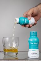 The Plug Drink poured from the bottle into a glass